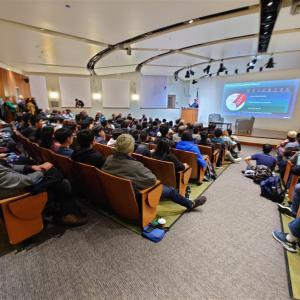 full auditorium listening to Dr. Anirudh Devgan, president and CEO of Cadence