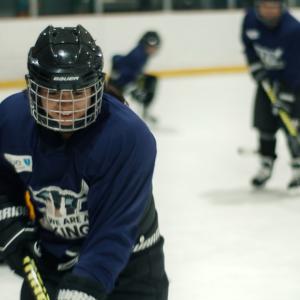 students playing hockey