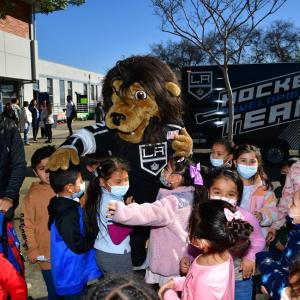 LA Kings mascot Bailey meets with a group of students at 49th Street Elementary School for AEG's Service Day.