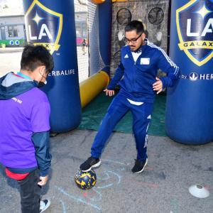 A student participates in the LA Galaxy's soccer clinic at AEG's Service Day.