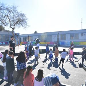 Students participate in the LA Kings ball hockey clinic at AEG's Service Day.
