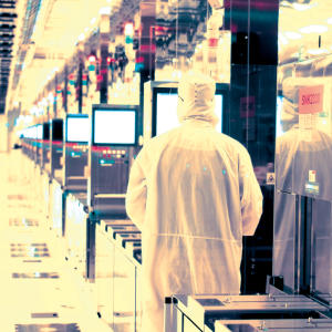 employee in clean suit in lab