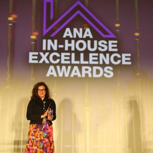 CARE representative accepting an award on-stage.