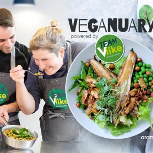 2 chefs sample vegan food. Next to them is a bowl of vegan food with text reading, “Veganuary”