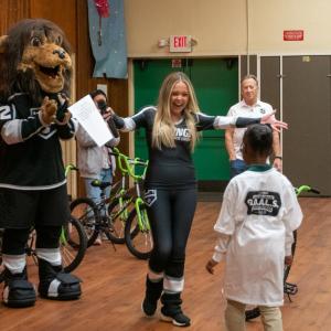 LA Kings Ice crew congratulates a student at the assembly.