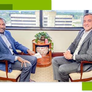 Leroy Abrahams and Mike Suco sat opposite each other