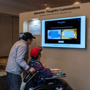 2 people visit the LG Exhibit at CSUN Assistive Technology Conference