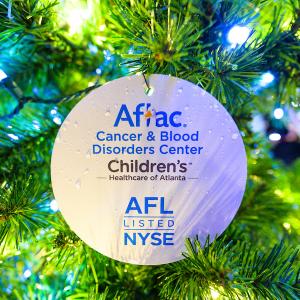 Aflac ornament shown on a Christmas tree. 