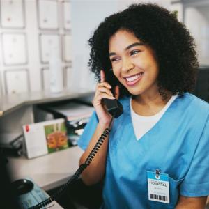 A medical professional taking a phone call.
