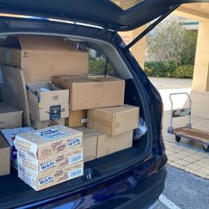 Aflac PLADS car shown filled with supplies for the closet.