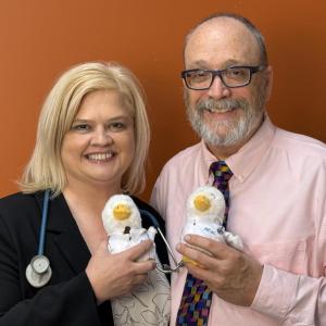 Tom and Tricia shown holding Aflac Ducks.