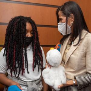 Doctor with patient holding an Aflac duck.