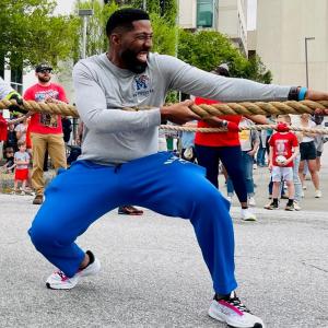 Marcus Jones pulling a firetruck.