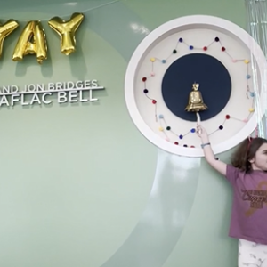 Noelle ringing the Aflac bell for cancer.