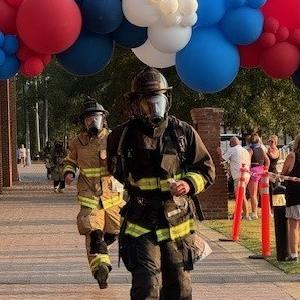 Firefighter shown in the Firefighter 5K race for CURE Childhood cancer.