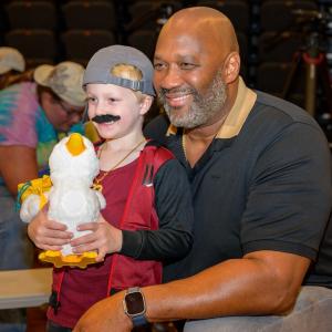 Young camper at Sunrise Day Camp shown with his Aflac My Special Duck.