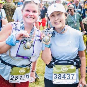 Alycia and Sandy showing their medals from the Marine Corps Marathon.