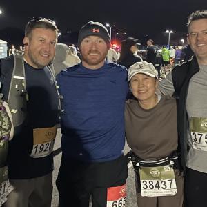 Aflac Team Members shown after the marathon with their medals.