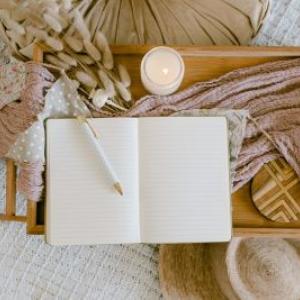 A blank journal shown with a pencil.