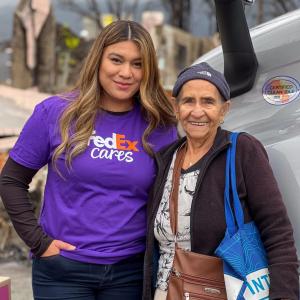 FedEx Cares volunteer with elderly woman
