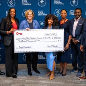 Albany Black Chamber representatives receive a $200,000 grant check from KeyBank.