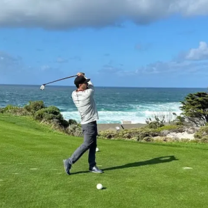 Alec Erceg playing golf.