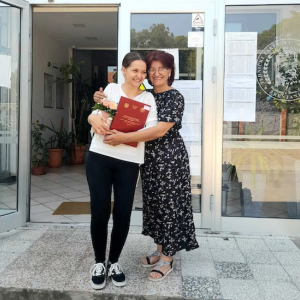 Aleksandra shown with her mom.