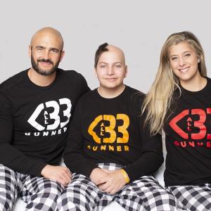 Brittany and family wearing All Heart Gunner sweatshirts. 