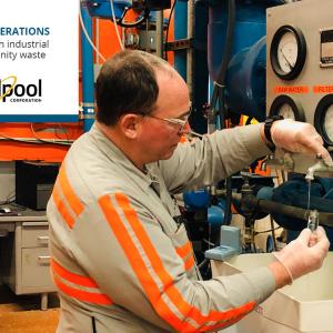 a person takes a water sample from a faucet