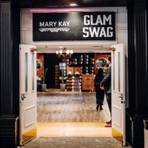Sign reading, "Mary Kay: GLAM SWAG"