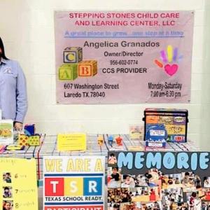 Angelica behind a table decorated and a poster behind her "Stepping Stones Child Care."