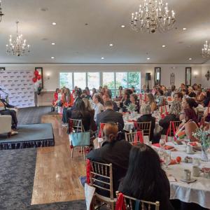 people sitting at tables at event