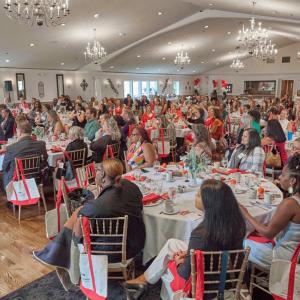 people sitting in tables at event