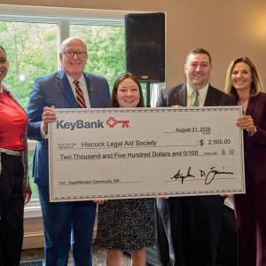people holding display check together