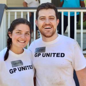 Anthony Reyna and his wife, Corinne, in front of a house