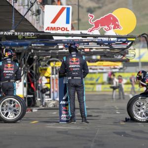 people standing at a racing track