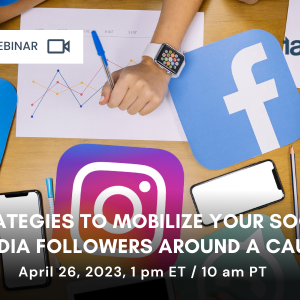 Hands working on desk with different social media icons.