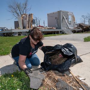 volunteer picking up trash