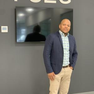 Photo of Ardell Boatwright stood infront of a screen