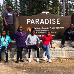 Photo of family posing outside Mount Rainier Park