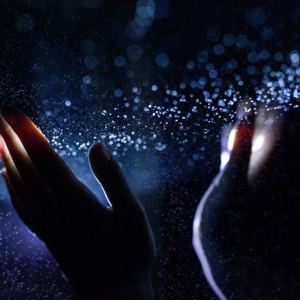 Hands touching water