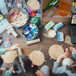 group doing arts and crafts with recyclables