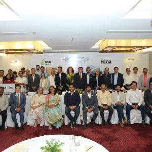 Attendees of the event are gathered for a group picture