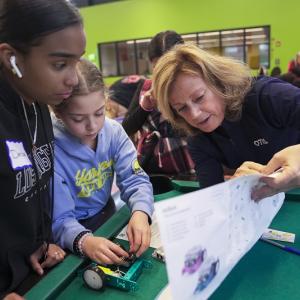 Otis volunteer working with Boys and Girls club members