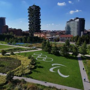 A performing land art installation featuring the Olympic rings and Paralympic Agitos