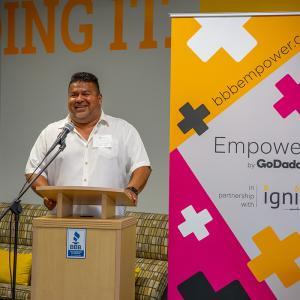 person speaking at a podium 