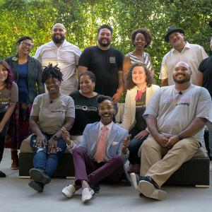 group of people posing for the picture together