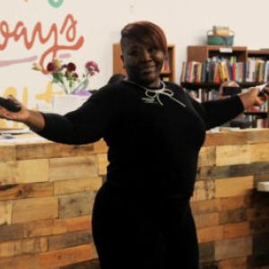 person holding out arms at Benton Harbor’s Pitch Night