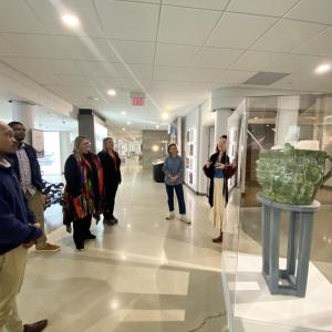 People looking at the sculpture in the gallery.