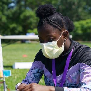 Science Club for Girls scientist, Jhianna, examining her rocket before its launch